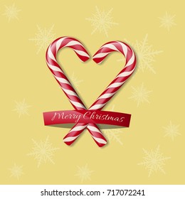 Merry Christmas design template. Two candy canes in heart shape with Merry Christmas text on yellow background.