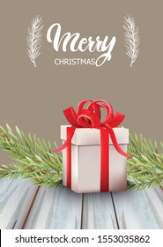 Merry christmas gift box with red ribbon and fir tree leaves. Wooden table. Holiday vector