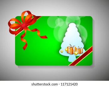 Merry Christmas gift card with beautiful decorated Xmas tree and ribbon. EPS 10.