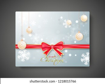 Merry Christmas gift card with red ribbon on snowflake background decorated with hanging baubles.