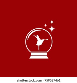 Merry christmas glass ball with a ballerina dancing in the snow. New Year gift.