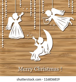 Merry Christmas Greeting Card with Angels on a wood background