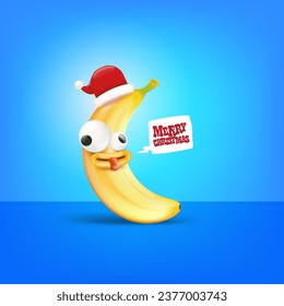 Merry Christmas greeting card and banner with funny cartoon banana character wearing santa red hat isolated on blue background. Funny and cute Christmas card with smiling Banana monster