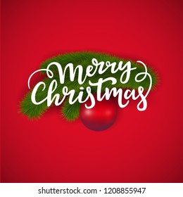 Merry Christmas greeting card design: hand written lettering text and new year fir tree branch with a winter decorations glass ball on a red background.