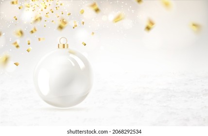 Merry christmas greeting card with lettering. Golden confetti falls on the background. Happy new year . Christmas ball.