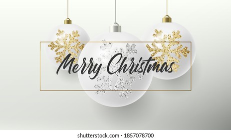 Merry Christmas greeting card or poster with white realistic Christmas balls hanging in a frame with calligraphy copy and golden and silver snowflakes illustration sparkling on them