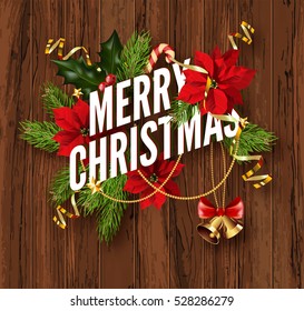 Merry Christmas greeting card template. Design for your holiday invitation with pine branches, christmas flowers, jingle bells and mistletoe or holly berry on wooden background. Vector Illustration.