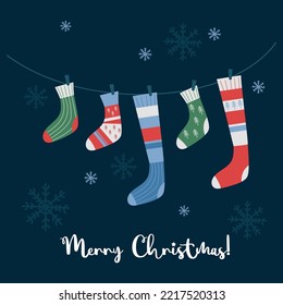 Merry Christmas greeting card. vector illustration. Winter theme postcard template with knitted decorative socks hanging on rope on blue background with snowflakes