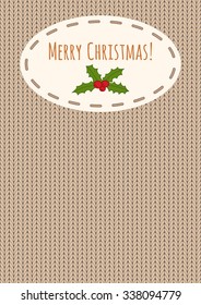 "Merry Christmas!" greeting and holly over a knitted background. Seasonal Christmas design with a place for your text. Suitable for a flyer, a party invitation or a greeting card.
