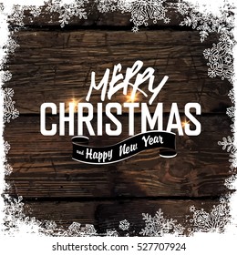 Merry Christmas! Greeting Tag on Wooden Background. Snowflakes border isolated by downside. Easy to use in design projects for holiday, as is postcard, invitations, covers, posters, banners... 