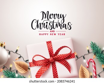 Merry christmas greeting text vector design. Christmas gift box in white elegant background for holiday season surprise present decoration. Vector illustration. 
