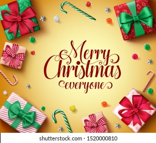Merry christmas greeting vector banner template. Merry christmas everyone typography text in empty space with decorative elements of colorful gifts, balls, candy cane and stars in yellow background.