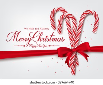 Merry Christmas Greetings in Realistic 3D Candy Cane and Christmas Balls in Background. Vector Illustration
