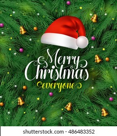 Merry christmas greetings typography with santa claus hat on a green pine leaves background with colorful christmas ornaments and decoration