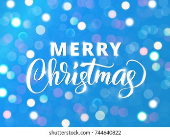 Merry Christmas hand drawn text. White and blue sparkling glowing lights background. Holiday greetings quote. Great For Christmas and New year cards, party posters, gift tags.