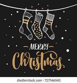 Merry Christmas hand lettering text. Greeting card with hanging knitted socks and falling snow.