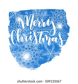 Merry Christmas hand written inscription with snowflakes on blue watercolor banner background