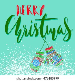 Merry Christmas. Handdrawn lettering for Christmas cards and posters. Mitten pair on a string.