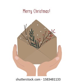 Merry Christmas. Hands holding envelope with nature elements branches. Vector illustration.