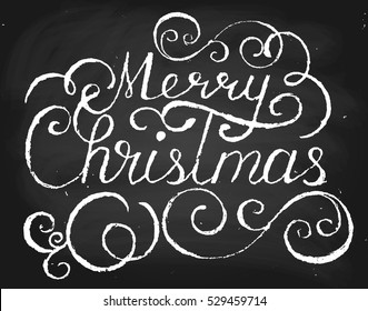Merry Christmas. Handwritten vector text in chalk style on blackboard.