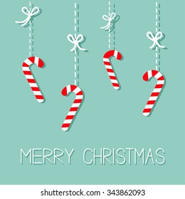 Merry Christmas Hanging Candy Cane. Dash line with bow. Flat design. Blue background. Vector illustration