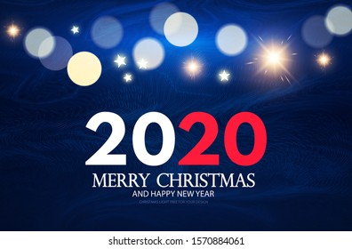 Merry Christmas and Happy New 2020 Year Holiday background with lettering, fir tree branches, bokeh effect, frost texture and lights.