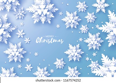 Merry Christmas and Happy New Year Greetings card. White Paper cut snowflakes. Origami Winter Decoration background. Seasonal holidays. Snowfall. Space for text. Blue.