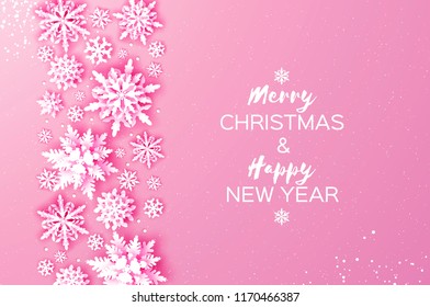 Merry Christmas and Happy New Year Greetings card. White Paper cut snowflakes. Origami Winter Decoration background. Seasonal holidays. Snowfall. Space for text. Pink.