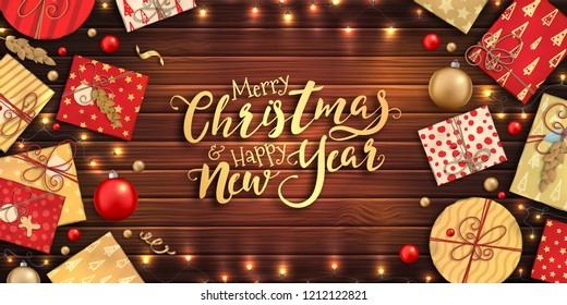 Merry Christmas and happy new year banner with Christmas decoration: colorful balls, red and gold gift box, garlands on wooden background. Xmas holiday greeting card, beautiful Christmas sale poster