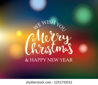 Merry Christmas and Happy New Year text. Hand drawn lettering. Holiday greetings quote. Blurred background for Christmas and New year cards, posters, gift tags. Vector.