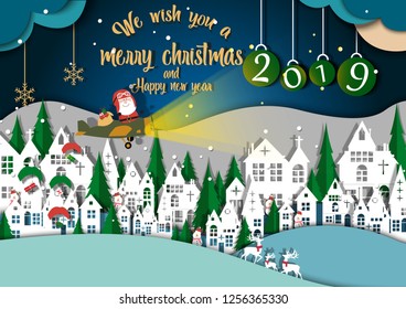 Merry Christmas and Happy New Year. Illustration of Santa Claus a plane on the sky, paper art and digital craft style, Christmas background copy space for text or messages for the New Year 2019.