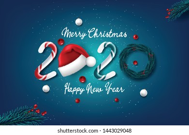 Merry Christmas and Happy New Year 2020 greeting card on wood background