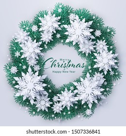 Merry Christmas and Happy New Year greeting card with paper snowflakes and fir pine tree branches in Christmas wreath decoration. Vector seasonal holidays background