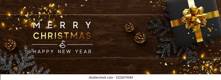 Merry Christmas and Happy New Year. Brown background from wooden boards, snowflakes with glitter sparkle, realistic pine cones, holiday black gift boxes. Xmas garlands and gold confetti, presents box