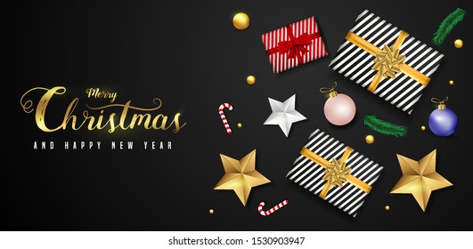 Merry Christmas and Happy New Year greeting card design with top view of baubles, gift box, stars and lighting garland decoration on black background.