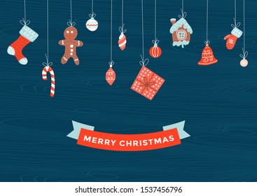 Merry Christmas and Happy New Year winter greeting card wooden background with xmas decoration elements hanging on ropes as garland in red and blue colors.