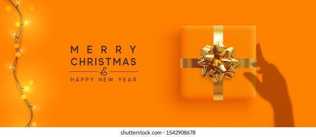 Merry Christmas and Happy New Year. Background with realistic gift box, bright christmas lights garland. Silhouette shadow from the hands holds Xmas presents. Creative getting card, holiday banner.