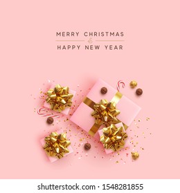 Merry Christmas. Happy New Year. Realistic pink gift boxes, glitter gold confetti, Chocolate round candy in foil, sweet cane. Xmas present. flat lay, top view. Festive background. Vector illustration