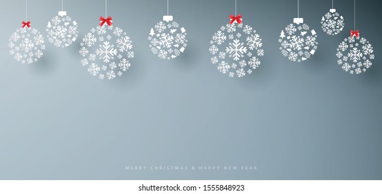 Merry Christmas and Happy New Year banner. Abstract white snowflakes on grey background. Paper art and craft design. Space for your design