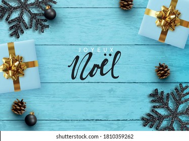 Merry Christmas Happy New Year. Xmas composition on wooden background. Design Realistic gift boxes, decoration snowflake black color, white garland, pine cone. Blue Wood texture. Flat lay, top view.