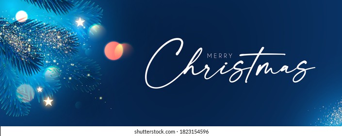 Merry Christmas and Happy New Year Holiday background with fir tree branches, bokeh effect and lights.