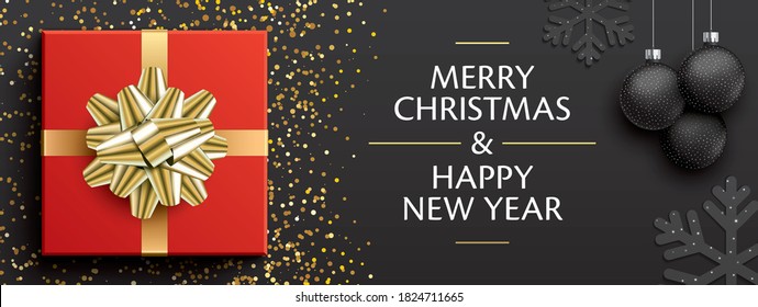 Merry Christmas & Happy New Year greeting card design. Red gift box with golden ribbon, Christmas tree balls and snowflakes on a black background. Premium style horizontal vector banner for xmas.