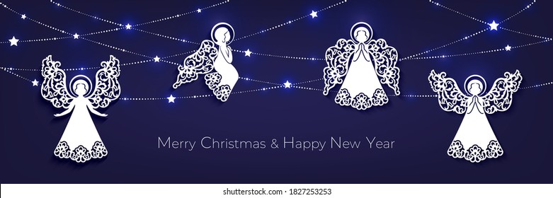 Merry Christmas and Happy New Year horizontal greeting card. White  paper cut decorative angels, garland with shine stars on a dark blue backdrop.