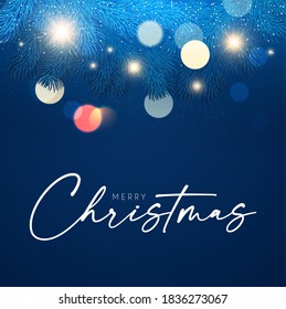 Merry Christmas and Happy New Year Holiday background with fir tree branches, bokeh effect and lights.