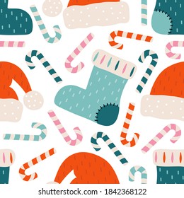 Merry Christmas and happy new year seamless pattern. Festive background with Christmas knitted sock, Santa Claus hat, candy cane, sweets. Xmas holiday  vector illustration in Scandinavian style