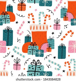 Merry Christmas and happy new year seamless pattern. Festive background with Christmas knitted sock, lots of gifts, sweets, candy cane. Xmas illustration in Scandinavian style. Vintage colors palette