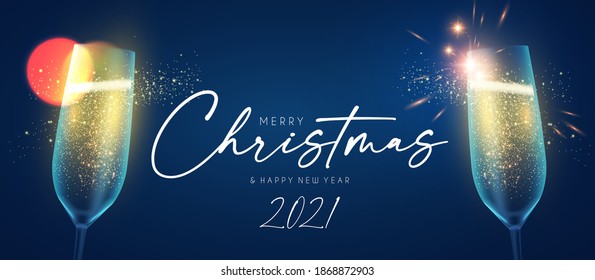 Merry Christmas and Happy New Year background with champagne glasses, lights and bokeh effect.