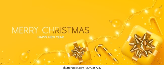 Merry Christmas and happy new year background. Yellow 3D gift boxes with Christmas ball, candy cane, Christmas light garland and confetti on a yellow background.