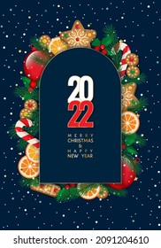 Merry Christmas and Happy New Year 2022 bright vector card with realistic Christmas ball, gingerbread cookies, fir tree branches, orange slices, candy cane, snow, arch shape frame, blue background