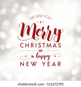 Merry Christmas and Happy New Year greeting card. Modern calligraphy lettering. Typographic vector design, beautiful light bokeh background, festive lights.